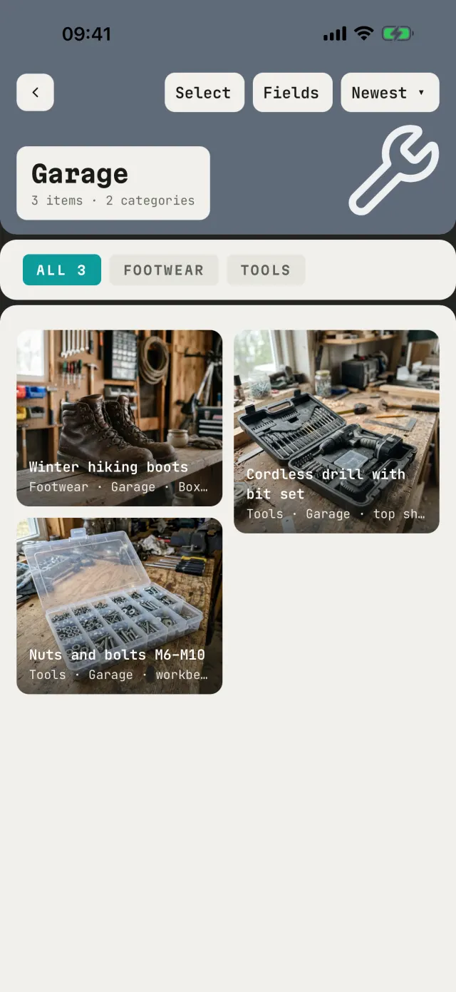 The Garage catalog with boots, a cordless drill and bolts